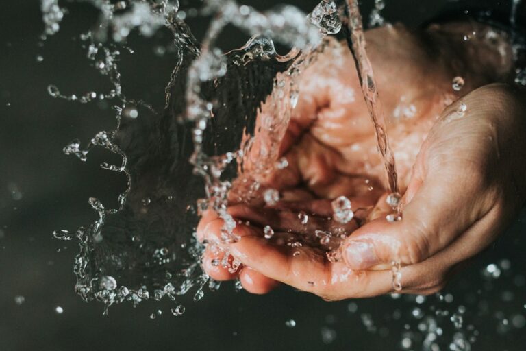 Hands under running water for a guide about choosing a gentle facial cleanser